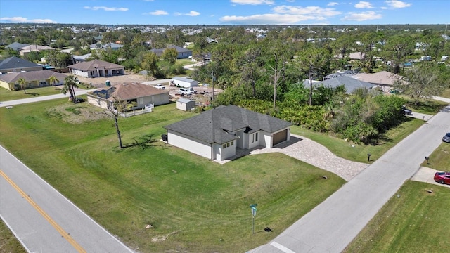 birds eye view of property with a residential view