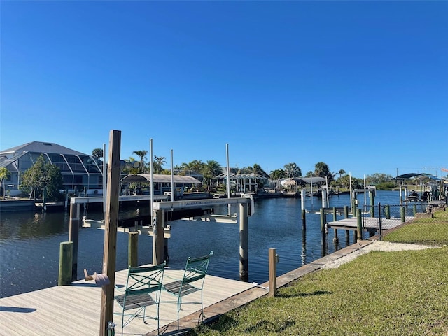 dock area featuring a yard, a water view, and boat lift