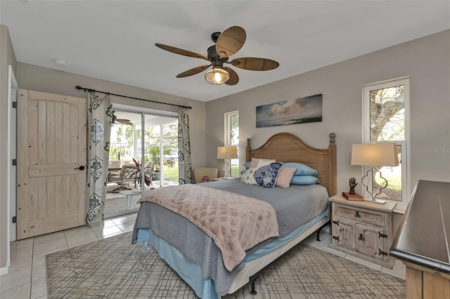 bedroom with access to exterior, ceiling fan, and light tile patterned floors