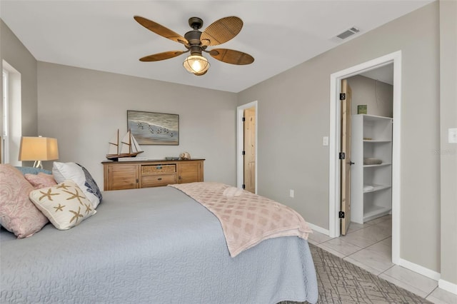 bedroom with visible vents, ceiling fan, baseboards, and light tile patterned flooring