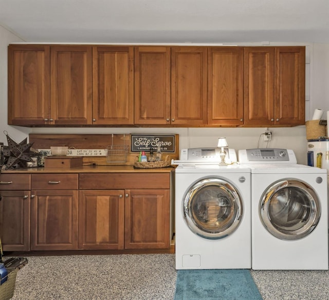 laundry area with cabinet space and washing machine and clothes dryer