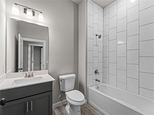 full bathroom with wood tiled floor, a textured wall, vanity, and toilet