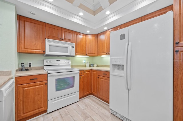 kitchen featuring white appliances, recessed lighting, light countertops, and ornamental molding