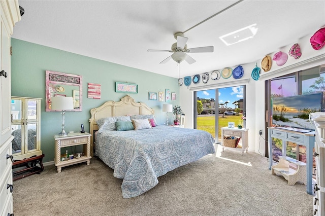 bedroom with access to outside, carpet flooring, and ceiling fan