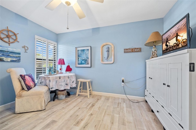 bedroom featuring wood finished floors, baseboards, and ceiling fan