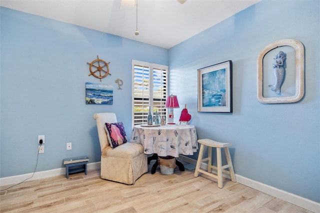 home office featuring baseboards and wood finished floors