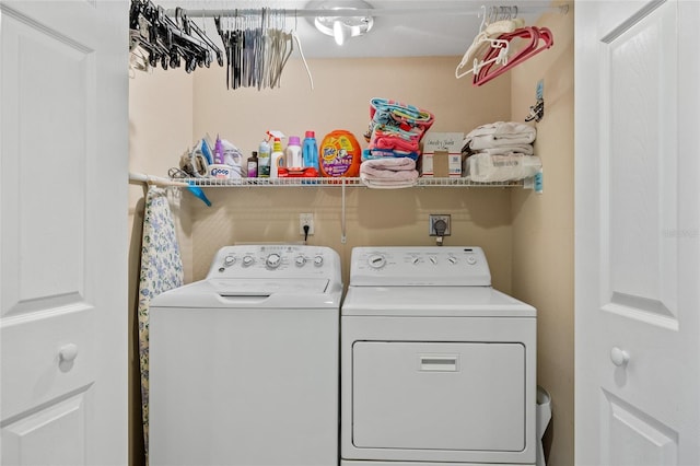 washroom featuring independent washer and dryer and laundry area