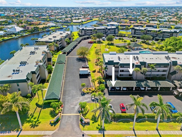 aerial view with a water view and a residential view