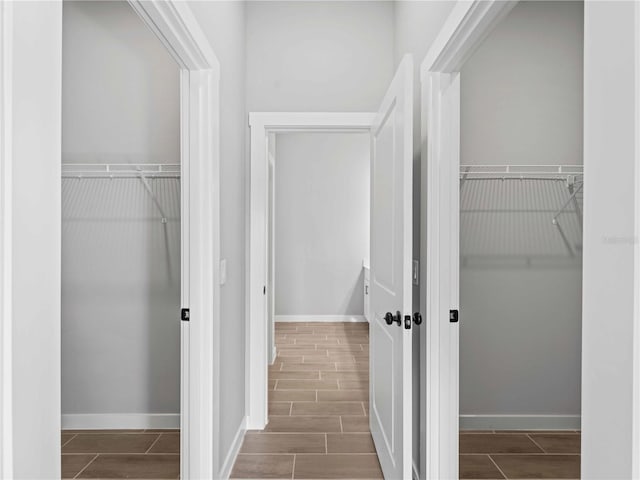 spacious closet with wood finish floors