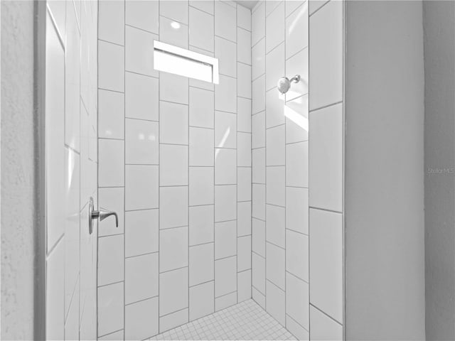 bathroom with tiled shower