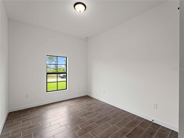 12156 Wellington Ave, Port Charlotte, FL 33981 - spare room featuring wood tiled floors and baseboards