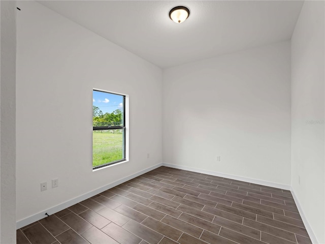 12156 Wellington Ave, Port Charlotte, FL 33981 - unfurnished room with wood finish floors and baseboards