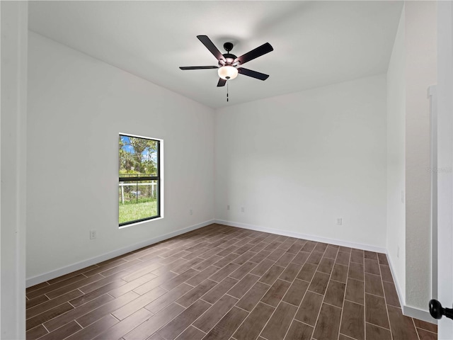 12156 Wellington Ave, Port Charlotte, FL 33981 - unfurnished room with dark wood finished floors, ceiling fan, and baseboards