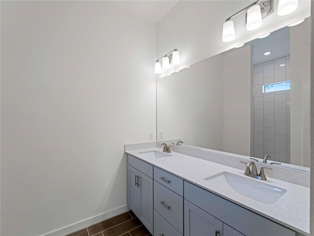 12156 Wellington Ave, Port Charlotte, FL 33981 - full bath with baseboards, double vanity, and wood finished floors