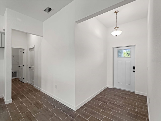 12156 Wellington Ave, Port Charlotte, FL 33981 - entrance foyer featuring wood tiled floors and baseboards