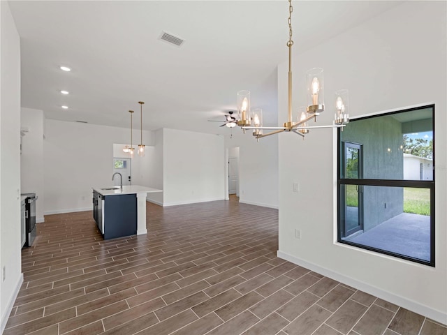 12156 Wellington Ave, Port Charlotte, FL 33981 - kitchen featuring a chandelier, a sink, baseboards, and recessed lighting