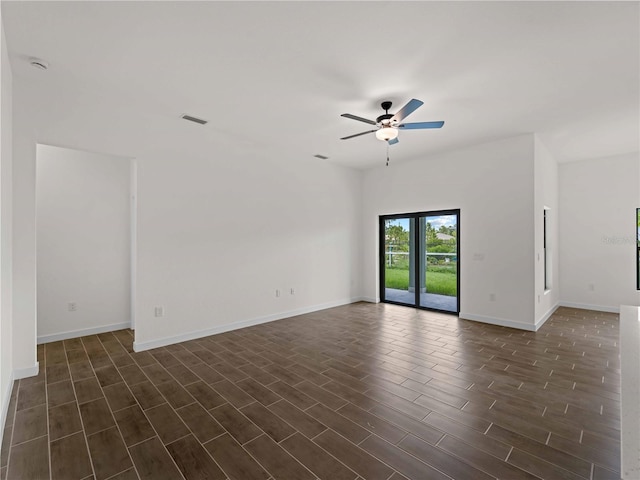 12156 Wellington Ave, Port Charlotte, FL 33981 - spare room featuring ceiling fan, dark wood-type flooring, and baseboards