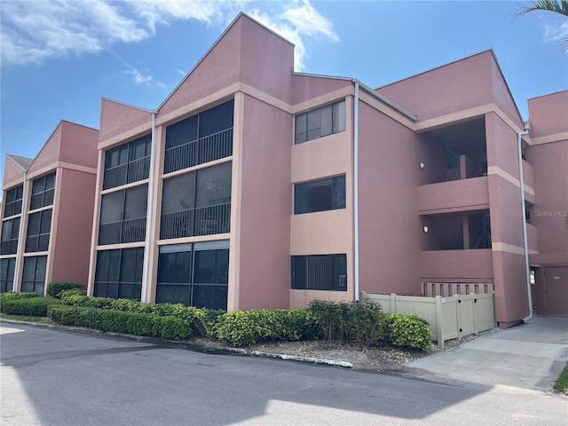 view of building exterior featuring fence