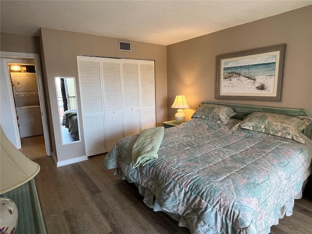 bedroom with a closet, visible vents, and wood finished floors