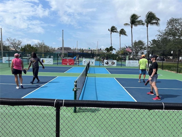 view of tennis court with fence