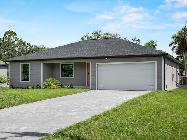 17331 Elmwood Ave, Port Charlotte, FL 33948 - single story home featuring a garage, decorative driveway, and a front lawn