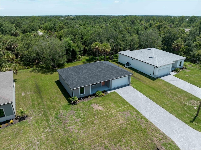 17331 Elmwood Ave, Port Charlotte, FL 33948 - aerial view of property and surrounding area with a heavily wooded area