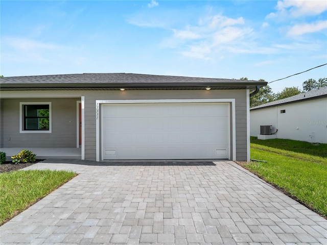 17331 Elmwood Ave, Port Charlotte, FL 33948 - garage featuring decorative driveway