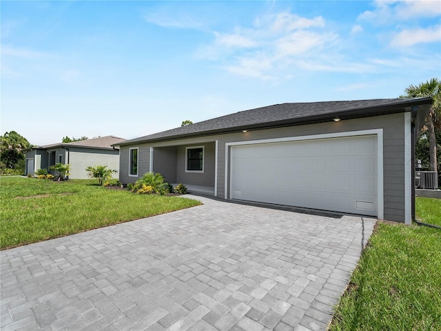 17331 Elmwood Ave, Port Charlotte, FL 33948 - single story home featuring decorative driveway, a front yard, and a garage