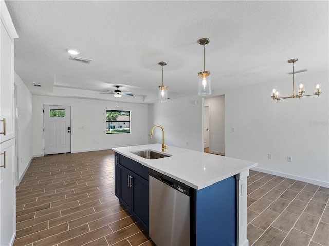 17331 Elmwood Ave, Port Charlotte, FL 33948 - kitchen featuring stainless steel dishwasher, wood tiled floors, light countertops, a ceiling fan, and open floor plan