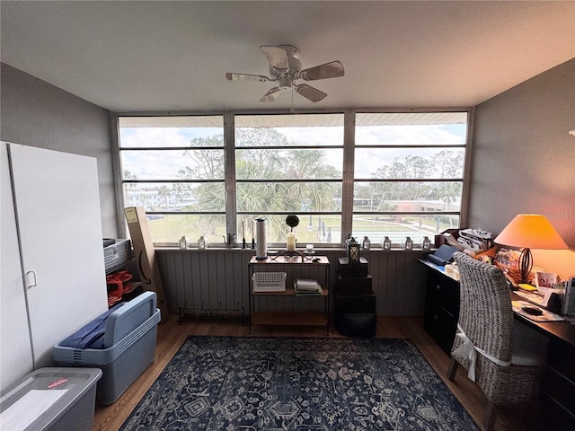 office with a ceiling fan and wood finished floors