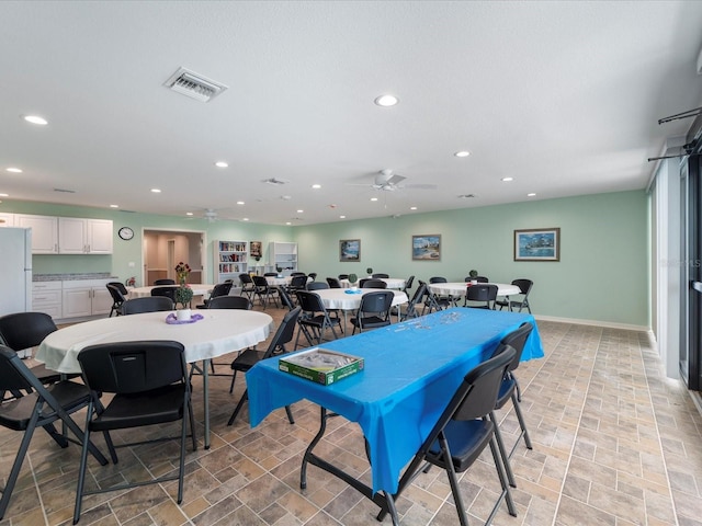 dining area featuring a ceiling fan, recessed lighting, visible vents, and baseboards