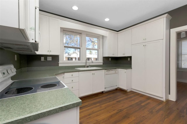 kitchen featuring a sink, white dishwasher, white cabinets, and electric stove