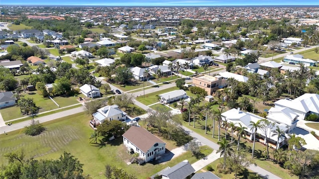 birds eye view of property with a residential view