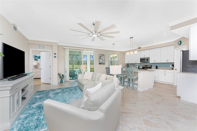 living room featuring visible vents, recessed lighting, crown molding, and a ceiling fan