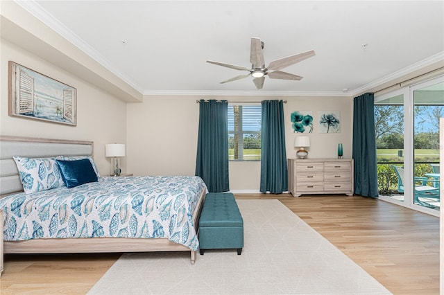 bedroom featuring multiple windows, wood finished floors, and ornamental molding