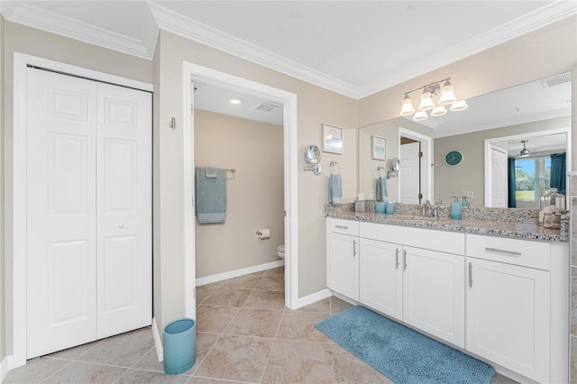 bathroom featuring a closet, toilet, ornamental molding, and vanity