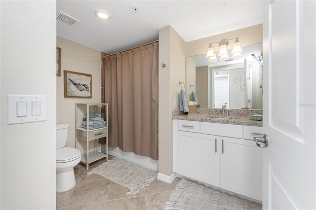 bathroom with tile patterned flooring, visible vents, toilet, and vanity