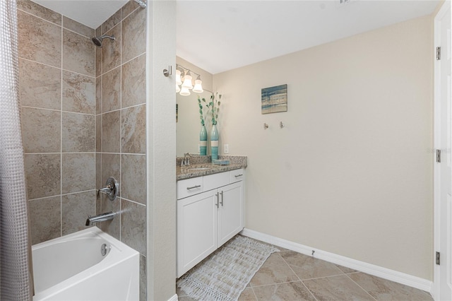 full bath featuring tile patterned flooring, vanity, shower / tub combo with curtain, and baseboards