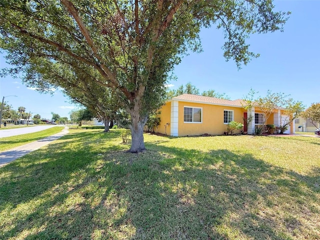 22299 Catherine Ave, Port Charlotte, FL 33952 - exterior space featuring a front lawn and stucco siding