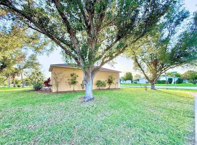 22299 Catherine Ave, Port Charlotte, FL 33952 - exterior space featuring a lawn and stucco siding