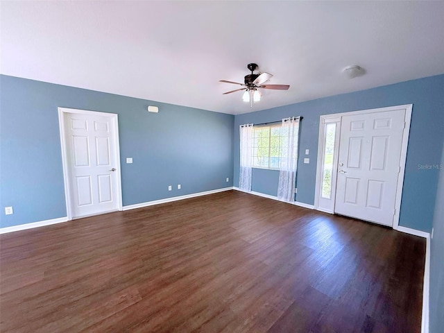 22299 Catherine Ave, Port Charlotte, FL 33952 - unfurnished room with dark wood finished floors, baseboards, and a ceiling fan