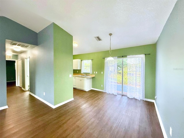 22299 Catherine Ave, Port Charlotte, FL 33952 - interior space featuring dark wood finished floors, visible vents, baseboards, and a sink