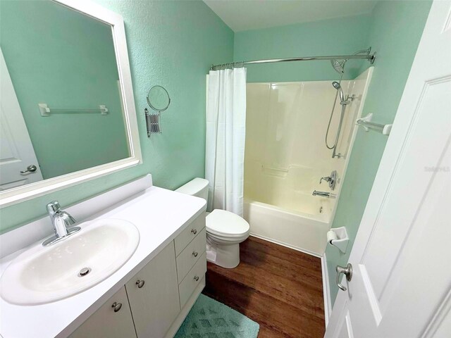 22299 Catherine Ave, Port Charlotte, FL 33952 - full bathroom with wood finished floors, toilet, vanity, and shower / bath combination with curtain