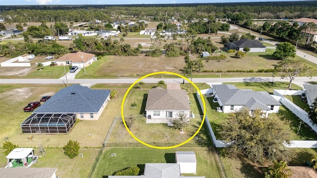 birds eye view of property with a residential view