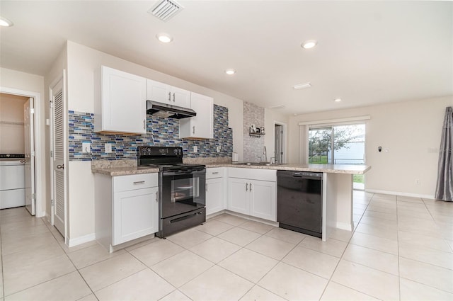 kitchen with visible vents, a peninsula, under cabinet range hood, black appliances, and a sink