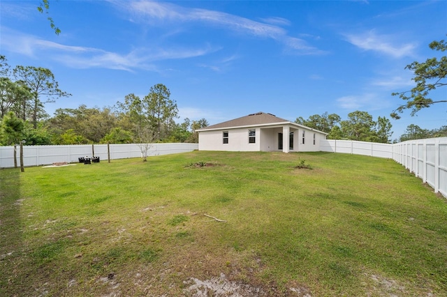 view of yard with a fenced backyard