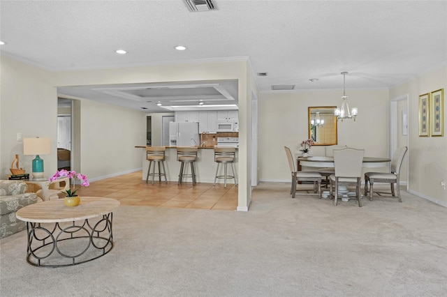 living area with light tile patterned floors, a raised ceiling, light colored carpet, a textured ceiling, and crown molding