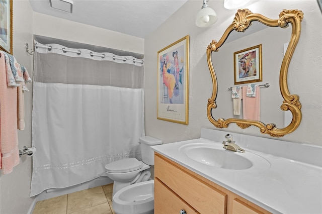 bathroom featuring tile patterned flooring, vanity, and toilet