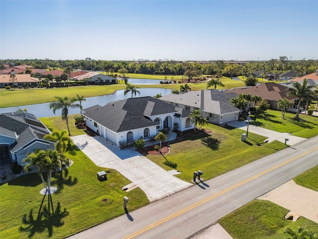 bird's eye view with a water view and a residential view