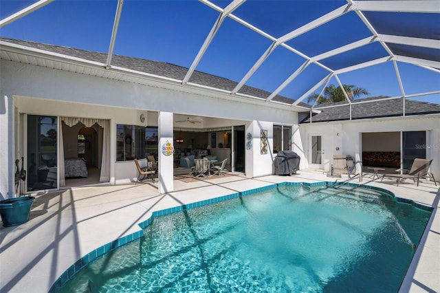 pool featuring a patio, a grill, a lanai, and ceiling fan